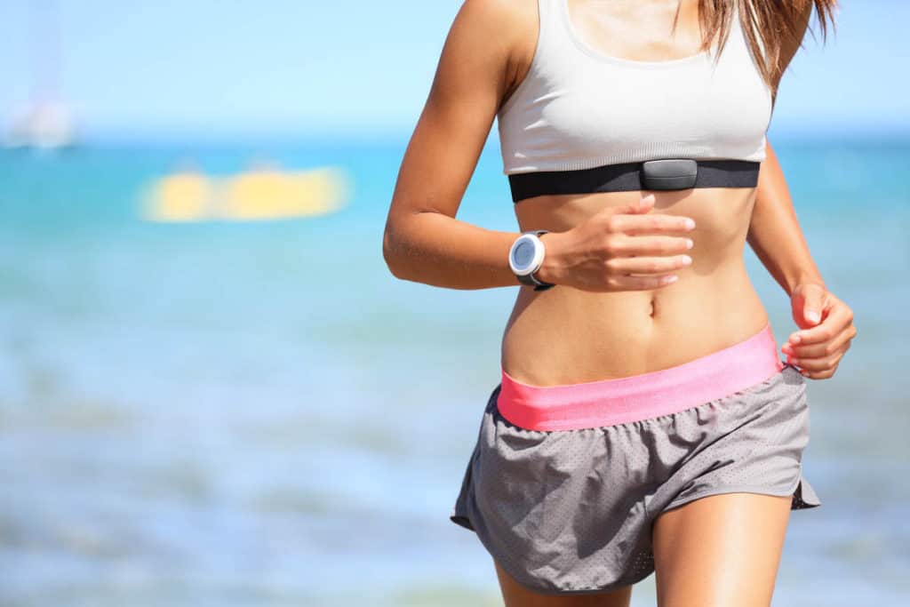 Woman with Heart Rate Monitor Running