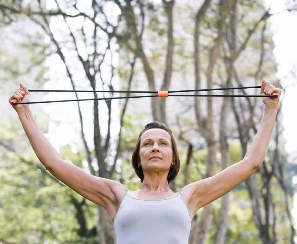 Woman Working Out With Resistance Band