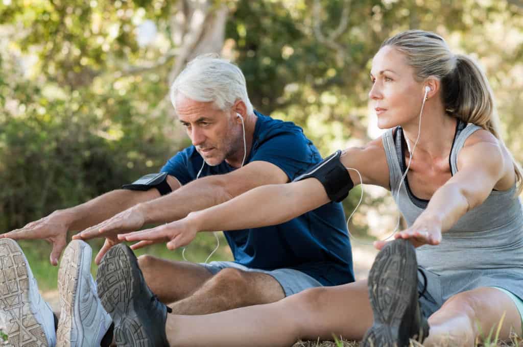 Couple Stretching at Park